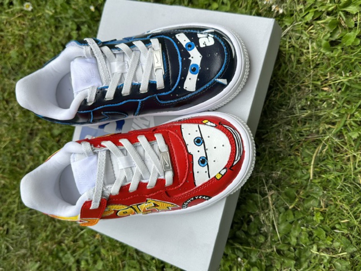 Kids mismatched movie-car customs — red racing car and space ranger pair